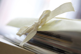 a close of photograph of some documents and folders tied with tape